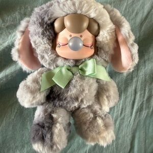 Adorable Nanci Plush Toy with Green Bow
